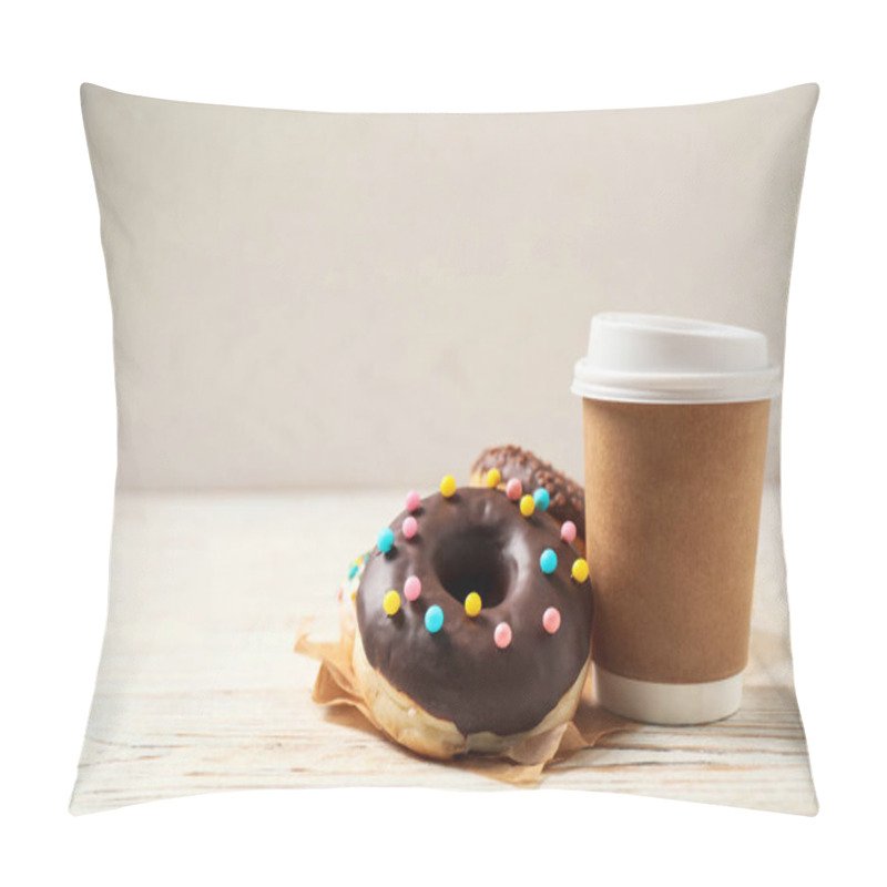 Personality  Delicious glazed donuts and coffee on white wooden table. Space for text pillow covers