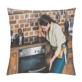 Personality  Confused Young Repairwoman Looking At Broken Oven With Smoke Inside Pillow Covers
