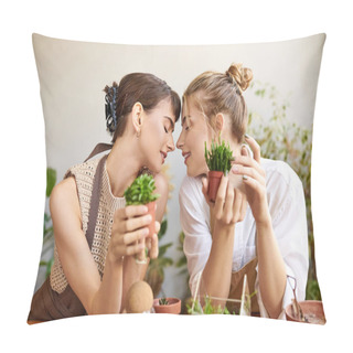 Personality  Two Women Enjoying A Serene Moment At A Table Surrounded By Potted Plants In Their Art Studio. Pillow Covers