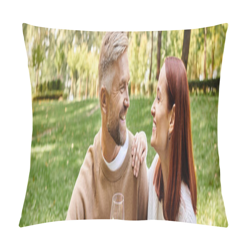 Personality  A loving couple sits peacefully in grass, enjoying a tender moment together. pillow covers
