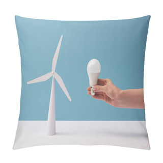 Personality  Cropped View Of Woman Holding Light Bulb Over White Table With Windmill Model On Blue Background Pillow Covers