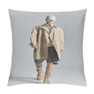 Personality  A Young, Tattooed Man Showcases An Edgy Look As He Confidently Walks Down A Runway In A Trench Coat And Hat. Pillow Covers