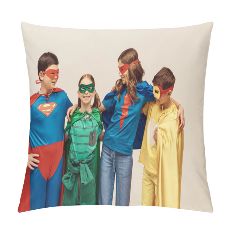 Personality  Happy Interracial Kids In Colorful Costumes With Cloaks And Masks Smiling And Hugging Joyful Girl On Grey Background In Studio, Child Protection Day Concept  Pillow Covers
