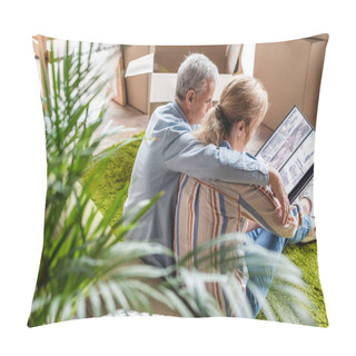Personality  High Angle View Of Senior Couple Looking At Photo Album While Moving Home Pillow Covers