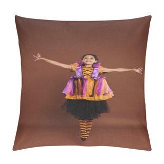 Personality  Happy Girl In Colorful Halloween Costume Looking At Camera And Jumping On Brown Background, Levitate Pillow Covers