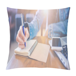 Personality  A Woman's Hand Is Writing In Empty Spiral Notepad With A Pen.On The Table Are The Phones That Are On The Laptop Computer.Web Banner. Pillow Covers