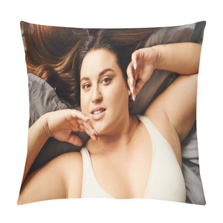 Personality  Top View Of Tattooed Plus Size Woman With Natural Makeup Lying In Beige Bodysuit On Bed With Grey Bedding While Touching Face And Looking At Camera, Body Positive, Modern Apartment, Portrait  Pillow Covers