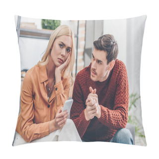 Personality  Husband Looking At Unhappy Young Woman Holding Smartphone And Looking At Camera At Home, Relationship Problem Concept Pillow Covers