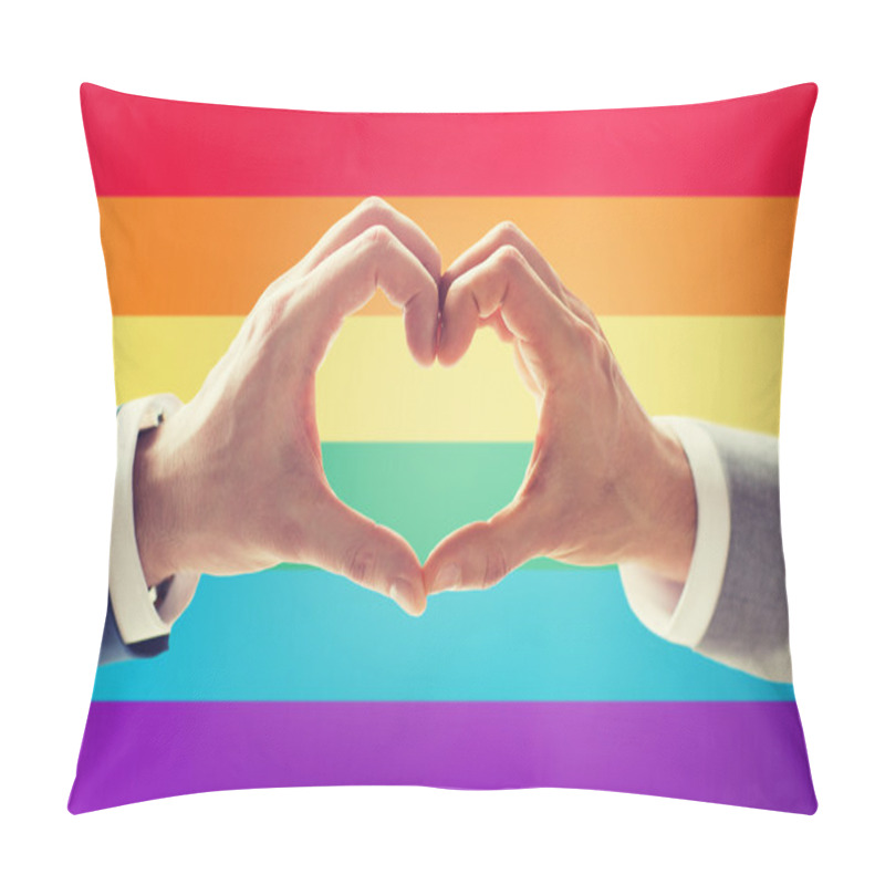 Personality  close up of male gay couple hands showing heart pillow covers