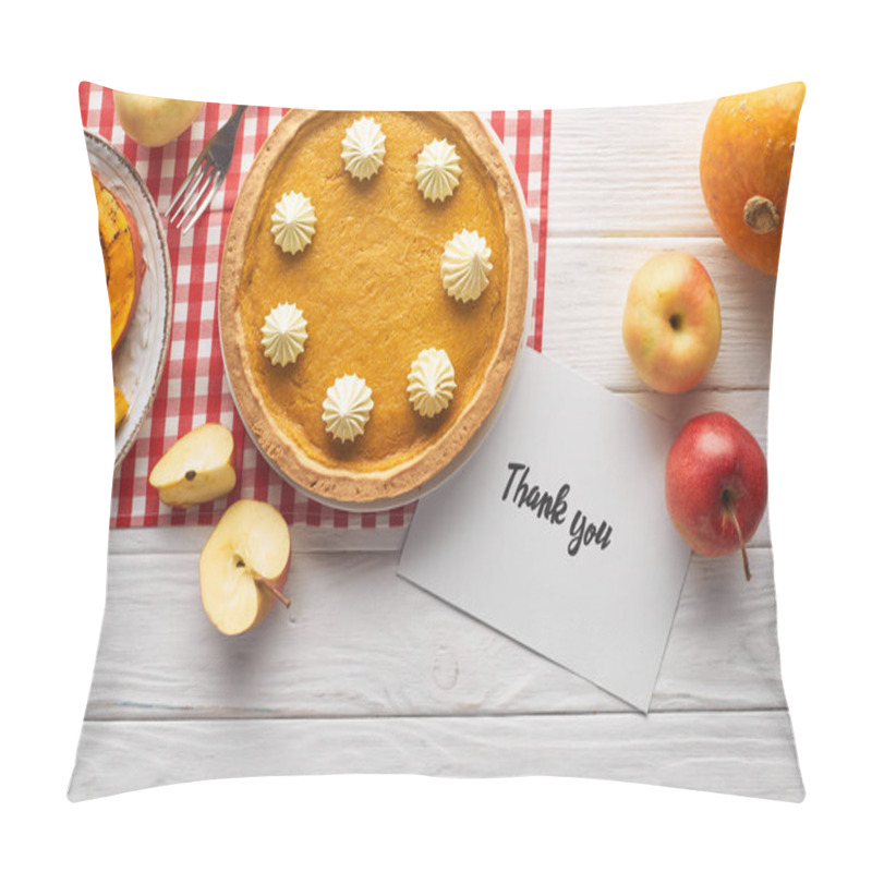 Personality  top view of traditional pumpkin pie with thank you card on wooden white table with apples pillow covers