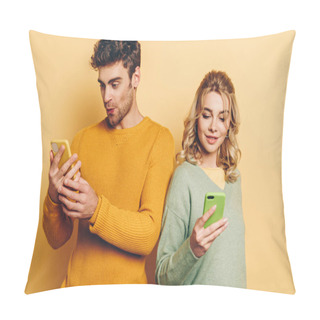 Personality  Positive, Attentive Couple Chatting On Smartphones On Yellow Background Pillow Covers
