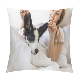 Personality  Selective Focus Of Young Woman Holding Puppys Ears While Lying In Bed Pillow Covers