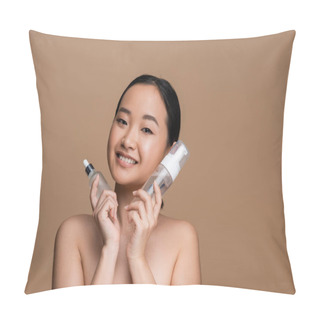 Personality  Cheerful Asian Model Holding Serum And Face Foam Isolated On Brown  Pillow Covers