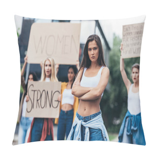 Personality  Serious Feminist Standing With Arms Closed Near Women Holding Placards With Feminist Slogans On Street Pillow Covers