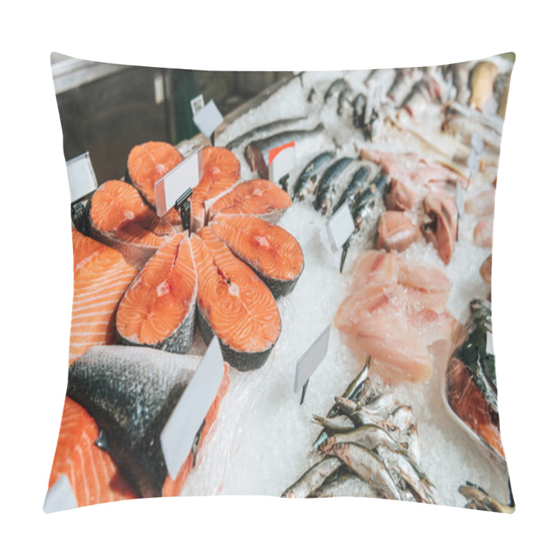 Personality  close up view of arranged raw seafood in supermarket pillow covers