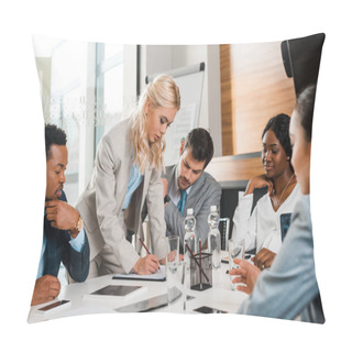 Personality  Selective Focus Of Attractive Businesswoman Writing In Notebook Near Multicultural Colleagues Sitting At Desk In Conference Hall Pillow Covers
