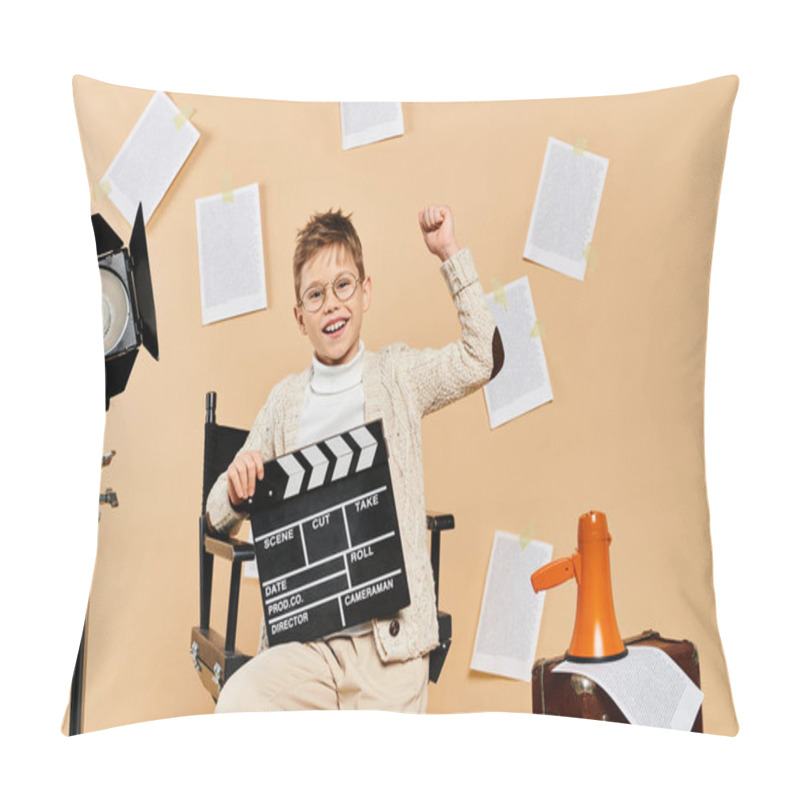 Personality  A Preadolescent Boy Dressed As A Film Director Sits With A Movie Clapper On A Beige Backdrop. Pillow Covers