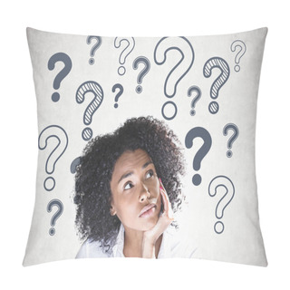 Personality  Portrait Of Thoughtful Young African American Woman With Curly Black Hair Looking Up With Her Hand On The Chin. Concrete Wall Background With Many Question Marks On It. Pillow Covers