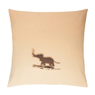 Personality  Top View Of Golden Toy Elephant With Shadow On Yellow Background, Extinction Of Animals Concept Pillow Covers