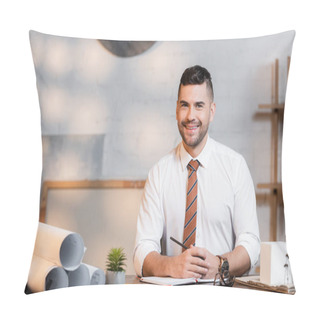 Personality  Smiling Architect Looking At Camera While Sitting At Workplace Near Rolled Blueprints Pillow Covers