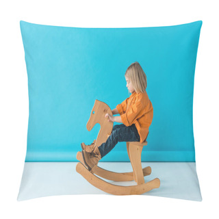 Personality  Side View Of Blonde And Cute Kid Riding On Rocking Horse On Blue Background Pillow Covers