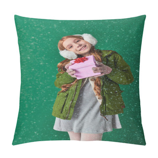 Personality  Pleased Girl In Ear Muffs, Scarf And Winter Attire Holding Christmas Present Under Falling Snow Pillow Covers