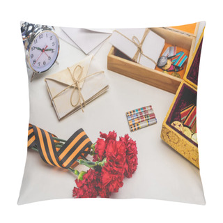 Personality  Closeup Shot Of Carnations Wrapped By St. George Ribbon, Letters, Medals In Boxes And Alarm Clock, Victory Day Concept  Pillow Covers