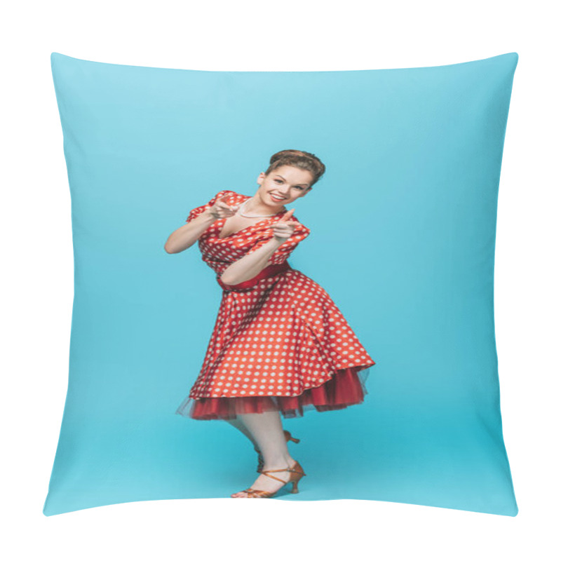 Personality  beautiful dancer pointing with fingers at camera while dancing boogie-woogie on blue background pillow covers