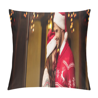 Personality  Panoramic Shot Of Happy Couple In Warm Sweaters And Santa Hats Embracing On Street Pillow Covers