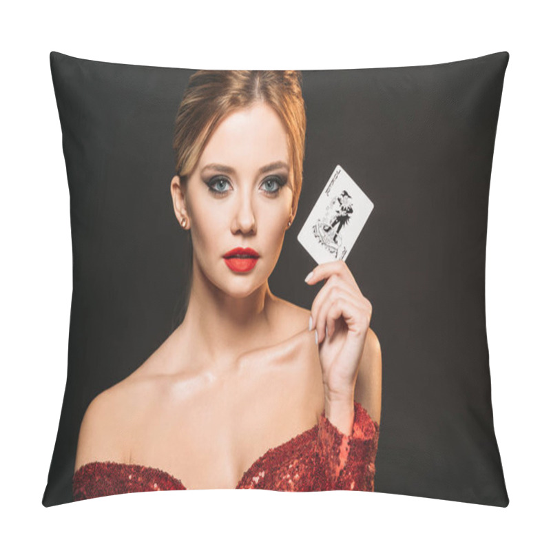 Personality  attractive girl in red shiny dress holding joker card and looking at camera isolated on black pillow covers