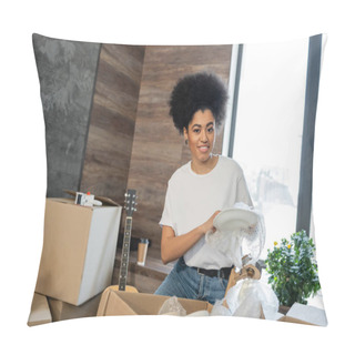 Personality  Smiling African American Woman Unpacking Tableware Near Cardboard Boxes In New House Pillow Covers