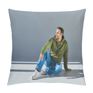 Personality  Indian Man In Casual Street Wear Sitting On Floor And Looking Away On Grey Background Pillow Covers