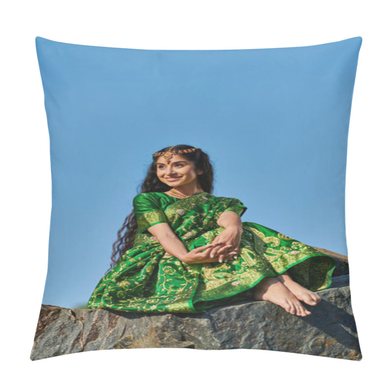 Personality  Carefree Young Indian Woman In Green Sari Sitting On Stone And Looking Away With Sky On Background Pillow Covers