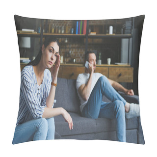 Personality  Depressed Woman Sitting On Couch While Her Husband Talking By Phone Blurred On Background Pillow Covers