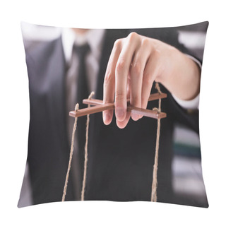 Personality  Close-up Of A Businessperson's Hand Manipulating Marionette With String Pillow Covers