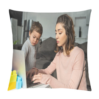 Personality  Selective Focus Of Little Boy Looking At His Mother Using Laptop At Table In Living Room At Home Pillow Covers