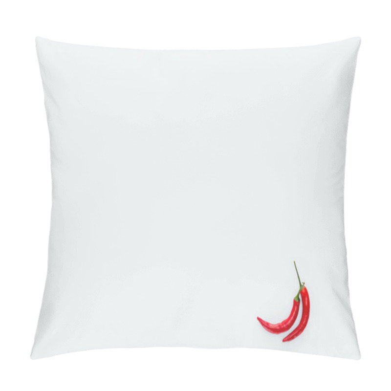 Personality  top view of two red chili peppers isolated on white pillow covers