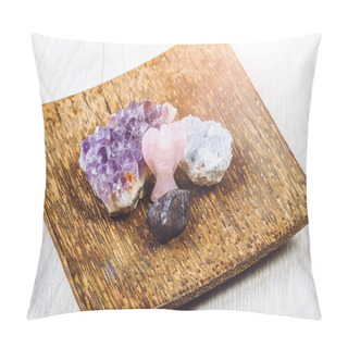 Personality  Group Of Gemstones On Wooden Tray In Home Interior. Rose Quarz Angel Figurine, Amethyst Geode And Celestite Geode Cluster And Iolite Cordierite Or Steinheilite. Pillow Covers