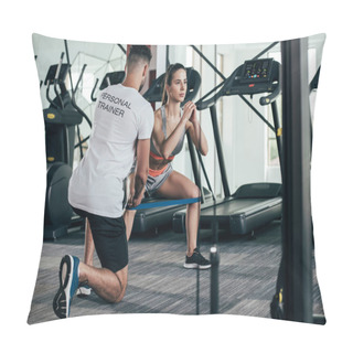Personality  Back View Of Personal Trainer Supervising Young Sportswoman Exercising With Resistance Band Pillow Covers