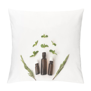 Personality  Three Bottles Of Essential Oil Surounded With Fresh Herbal Green Mint Leaves And Rosemary. Flat Lay On White Background. Medical Herbs, Design Concept. Copy Space For Text Pillow Covers