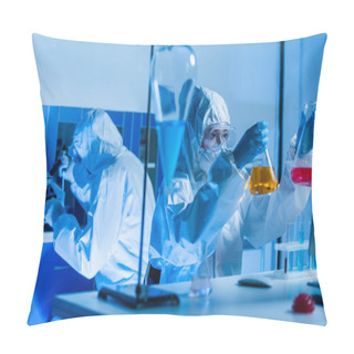 Personality  Geneticist In Personal Protective Equipment Holding Flasks With Colorful Liquid In Lab Pillow Covers