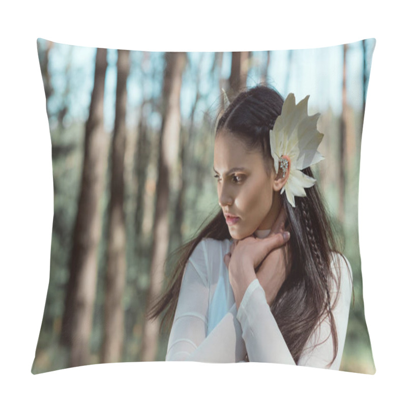 Personality  beautiful woman in white swan costume looking away, holding hands on neck pillow covers