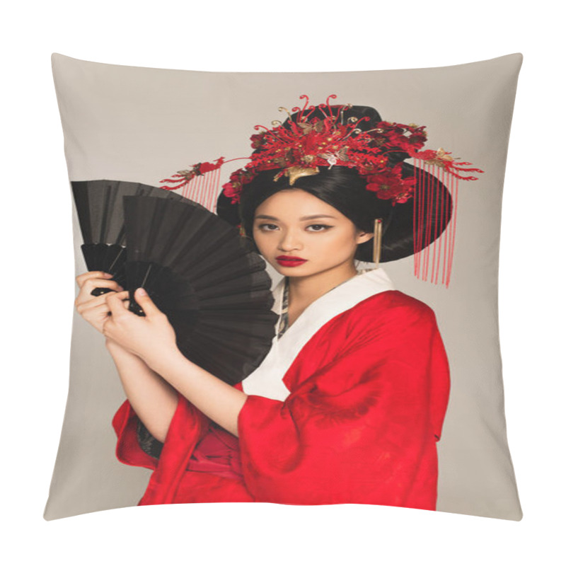 Personality  Pretty asian woman in red kimono holding fans and looking at camera isolated on grey  pillow covers