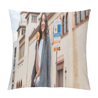 Personality  Young Curly Woman In Casual Grey Jacket Holding Ripe And Fresh Orange And Smiling At Camera With Historical Landmark At Background Outdoors In Barcelona, Spain, Banner, Ancient Building  Pillow Covers