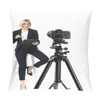 Personality  Smiling Broadcaster Pointing At Clipboard Near Digital Camera On White, Blurred Foreground Pillow Covers