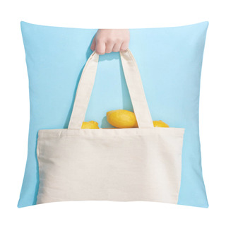 Personality  Cropped View Of Woman Holding Ripe Yellow Lemons In Cotton Bag On Blue Background Pillow Covers