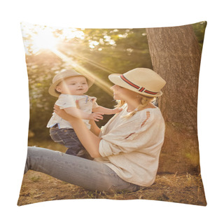 Personality  Slender Beautiful Blonde Mom In Jeans, A Beige Shirt And A Hat Holding A Baby Boy On The Background Of The Park At Sunset And Smiles Pillow Covers