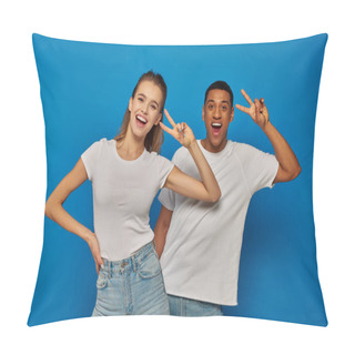 Personality  Cheerful Multicultural Couple Showing V Sign And Looking At Camera On Blue Background, Positivity Pillow Covers