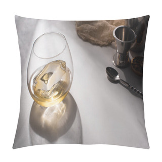Personality  Transparent Glass With Ice Cube And Whiskey On White Table With Shadow Near Cloth, Spoon And Jigger Pillow Covers