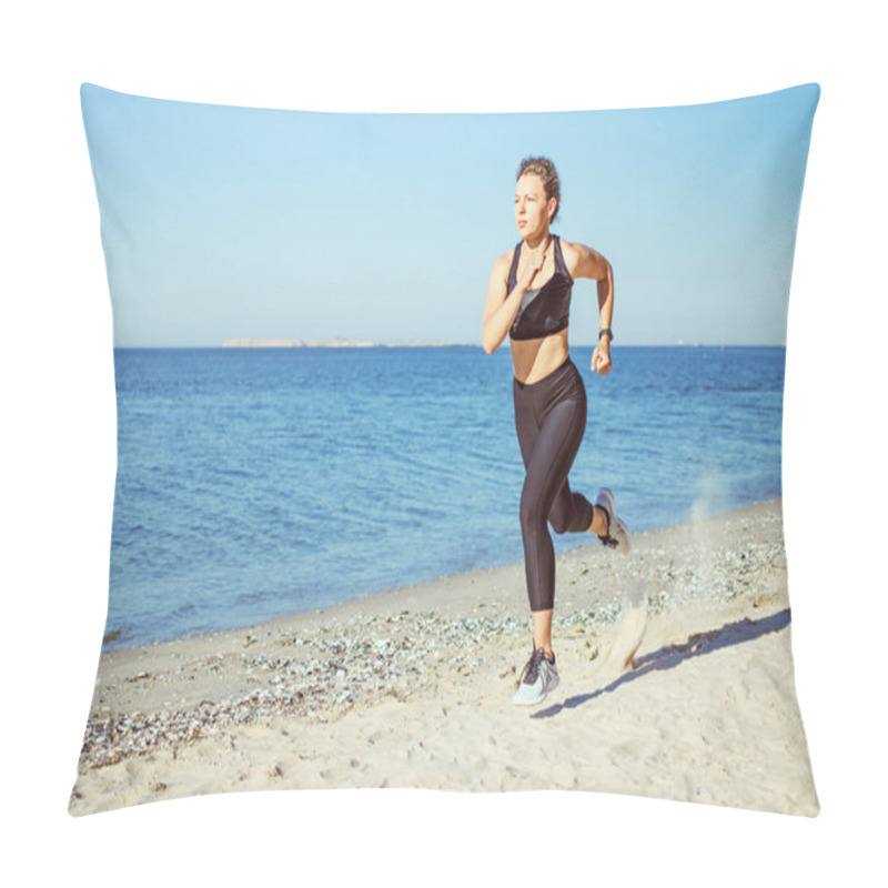 Personality  Concentrated Young Woman Jogger Running On Beach Outdoor Workout In Morning, Wearing Black Sportswear On Blue Sea And Sky Background. Weight Loss Cardio Goal Achievement Challenge. Copy Space. Pillow Covers